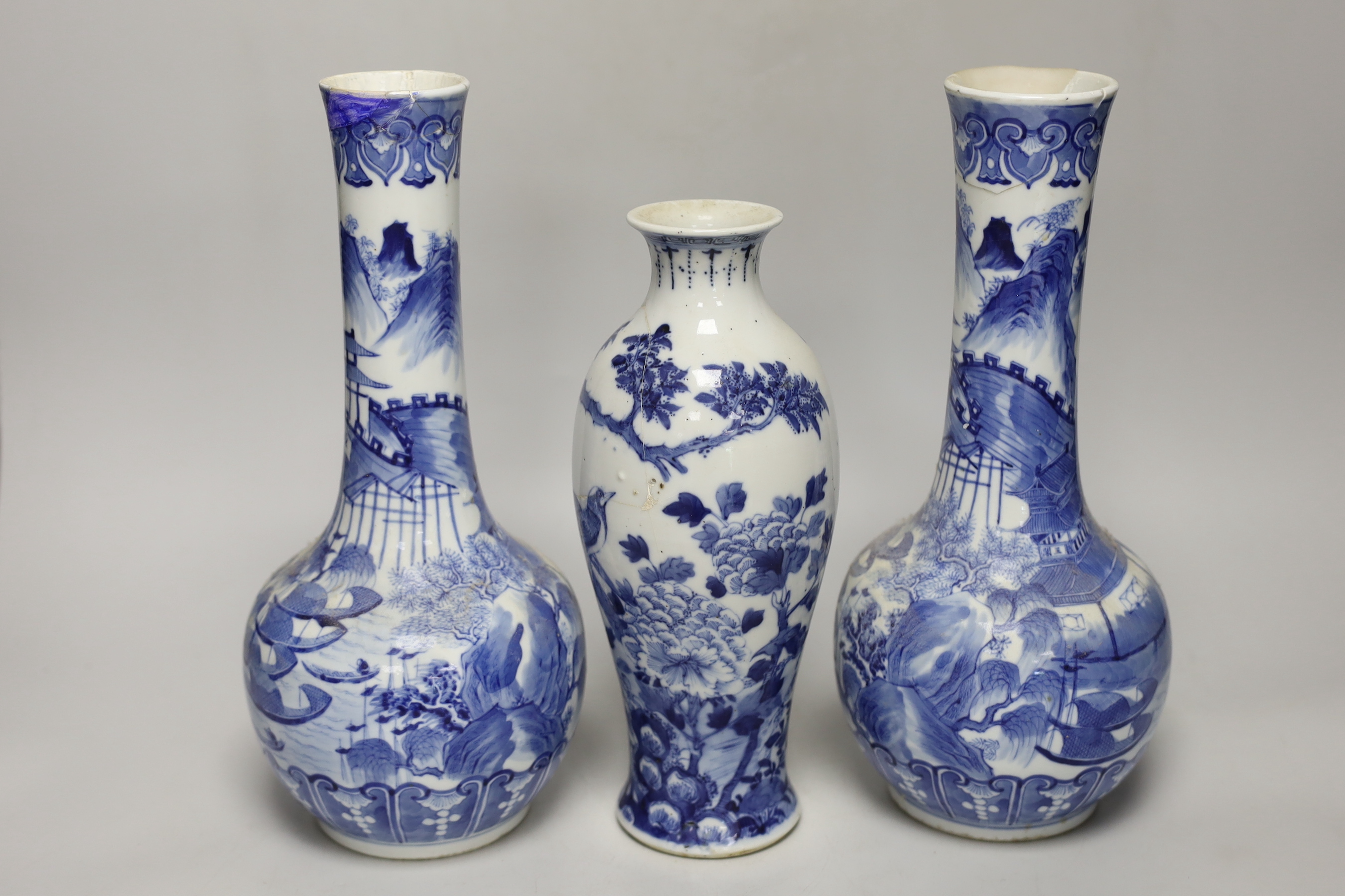 A pair of Chinese blue and white bottle vases and another vase, pair of vases 30cm high (a.f.)